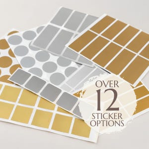 May include: Multiple sheets of adhesive labels in gold and silver colors, featuring various shapes including circles, squares, and rectangles. A circular overlay on the image displays the text OVER 12 STICKER OPTIONS in dark brown lettering.