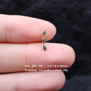 May include: A titanium threadless push pin featuring three small, marquise-cut green stones arranged in a vertical line. The text on the image specifies 20G, 18G, 16G gauges and 5, 6, 7, 8, 9, 10mm lengths for this body jewelry piece.