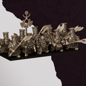 May include: A white ceramic mug with a black handle and the text "But First, Coffee" in a bold, black font. The mug is set against a blurred background, suggesting a cozy setting.