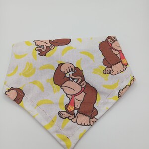 Pet Bandana: Nintendo - Donkey Kong reversible with red solid fabric 90s video game nostalgia for dogs, puppies, cats, kittens and more!