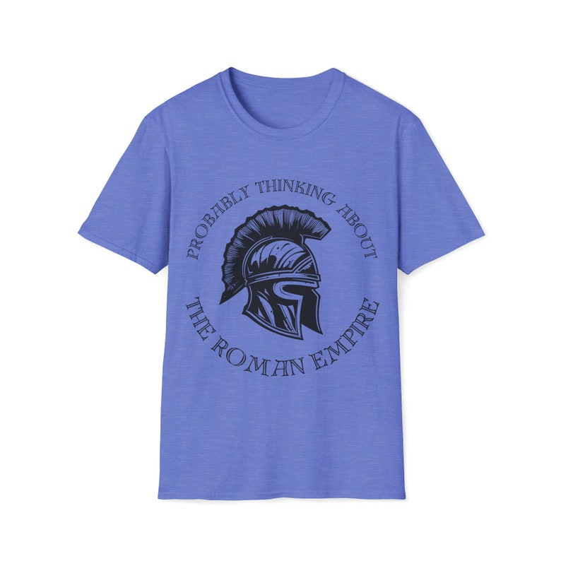 May include: A light blue t-shirt with a graphic of a Roman helmet inside a circle with the text "Probably thinking about the Roman Empire".