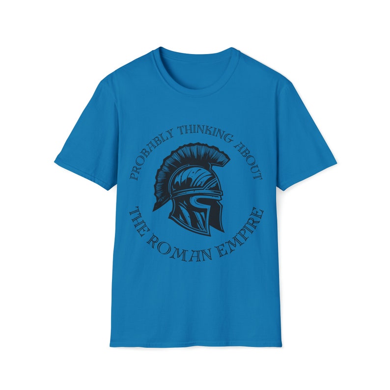 May include: A blue t-shirt with a black graphic of a Roman helmet and the text "Probably thinking about the Roman Empire".