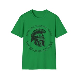 May include: Green t-shirt with a black graphic of a Roman helmet and the text "Probably thinking about the Roman Empire".