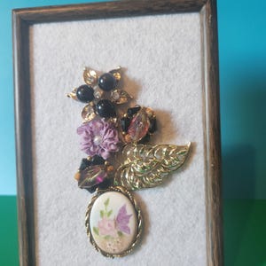 Framed vintage upcycled jewelry in purple and gold