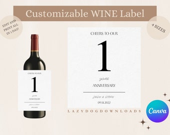 Könnte beinhalten: Eine anpassbare Weinetikettenvorlage mit dem Text "Cheers to our 1 year anniversary" und dem Datum "09.14.2022". Das Etikett ist für eine Weinflasche konzipiert und hat ein schlichtes, elegantes Design mit einer schwarzen Zahl Eins und den Wörtern "Cheers to our" und "Anniversary" in einer handschriftlichen Schriftart.