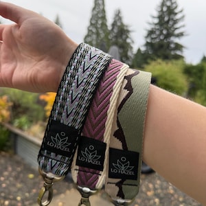 May include: A set of three ceramic mugs with a speckled, matte finish. The mugs are in shades of cream, light gray, and dark gray. Each mug has a simple, minimalist design, perfect for coffee or tea.