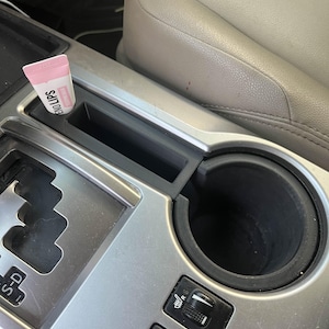 2014+ 4Runner mittkonsol förvaring av chapstick/telefon