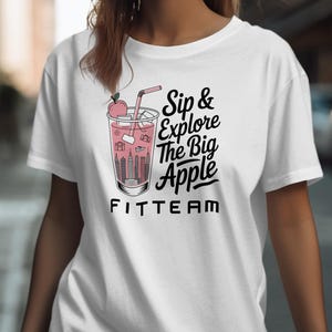 Fitteam Sip Explore Big Apple T-Shirt Sweatshirt, New York City Skyline Tee, Travel Lover Gift, NYC Vacation Souvenir, Adventure Apparel