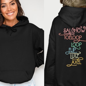 May include: Black hooded sweatshirt with a front pocket and drawstring. The back of the sweatshirt features colorful text: "SALCHOW, TOELOOP, LOOP, FLIP, LUIZ, AXEL."
