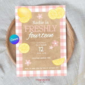 May include: A rectangular birthday invitation card with a pink and white gingham border and a tan center. It features yellow lemon illustrations, small pink flowers, and text reading: Sadie is FRESHLY fourteen, Saturday October 12, 2PM-4PM.