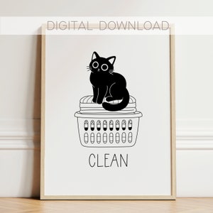 May include: Black and white illustration of a cat sitting on top of a laundry basket with the word "CLEAN" underneath.