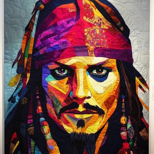 May include: A colorful, abstract portrait of a man with long hair and a bandana. The portrait is made of fabric pieces sewn together in a patchwork style.