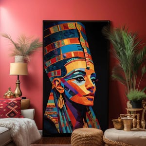 May include: A large framed art print of a colorful portrait of a woman with a tall headdress. The artwork features vibrant hues of blue, orange, yellow, and purple. The portrait is set against a black background, creating a striking contrast.