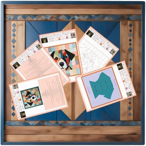 May include: Four printed sheets of paper with the text "Stylein Every Pattern" and a geometric dog design. The sheets are on a wooden surface with a blue and brown border.