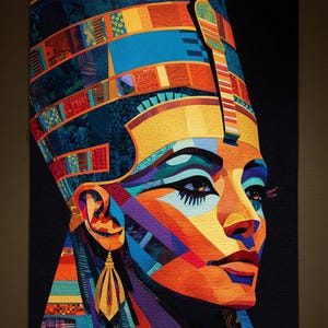 May include: A vibrant, geometric quilt depicting a profile of a person with an elaborate headdress. The artwork features a rich palette of colors, including blues, oranges, yellows, and purples, creating a striking visual effect. The quilt's design is reminiscent of ancient Egyptian art.