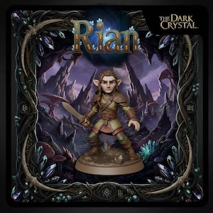 May include: A figurine of Rian from The Dark Crystal, holding a sword. The figure is dressed in brown and green armor, standing on a brown base. The background features a fantasy landscape with purple mountains and crystals. The title "Rian" is displayed at the top.