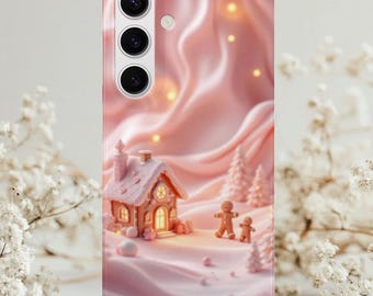 May include: A pink phone case featuring a whimsical winter scene. The design includes a gingerbread house, gingerbread people, and snow-covered trees. The background has a soft, flowing texture with glowing lights, creating a festive and charming aesthetic.