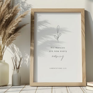 May include: A framed print with a simple line drawing of a plant and the text "His mercies are new every morning" with the scripture reference "Lamentations 3:23".
