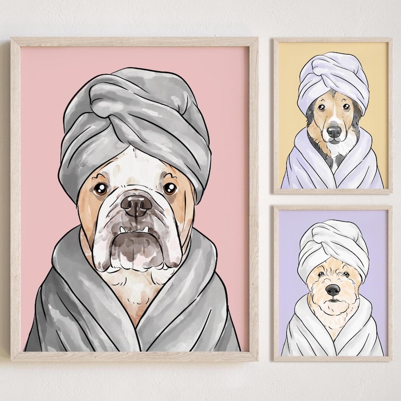 May include: Three framed illustrations of dogs wearing towels on their heads and bathrobes. The first dog is a bulldog with a gray towel and robe on a pink background. The second dog is a brown and white dog with a white towel and robe on a yellow background. The third dog is a white dog with a white towel and robe on a purple background.