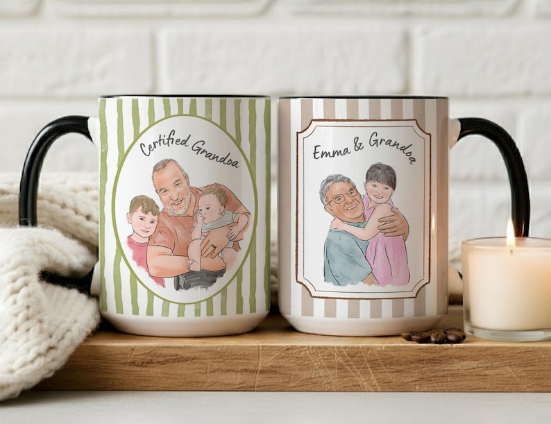 May include: Two ceramic mugs with black handles. The left mug has green vertical stripes and a circular illustration of a man with two children and the text Certified Grandpa. The right mug has beige stripes, a rectangular frame, an illustration of a man and a child, and the text Emma & Grandpa.