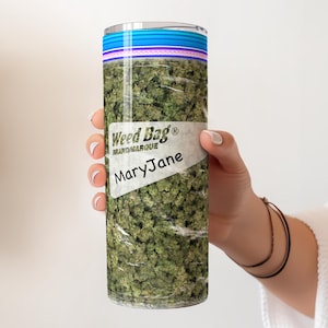 May include: A cylindrical tumbler featuring a design resembling a bag of cannabis. The tumbler has a clear body with a green and brown cannabis pattern. The label reads "Weed Bag" and "MaryJane".