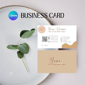 May include: A business card template with a brown and white colour scheme. The card features a logo placeholder, a QR code, and contact information for social media, email, and phone. The text on the card reads "Your Name" and "Title | Company Name | Tagline".