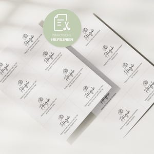 May include: Two sheets of white stickers with a grid pattern. Each sticker features a camera icon and handwritten text in black. A green circle with text and a scissors icon is in the upper left corner.