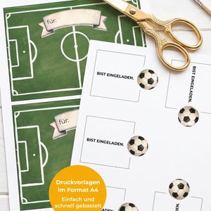 May include: Printed sheets with soccer field designs and soccer ball stickers. The sheets include the text "f&uuml;r:" and "BIST EINGELADEN." A pair of gold scissors and a paintbrush are also visible.