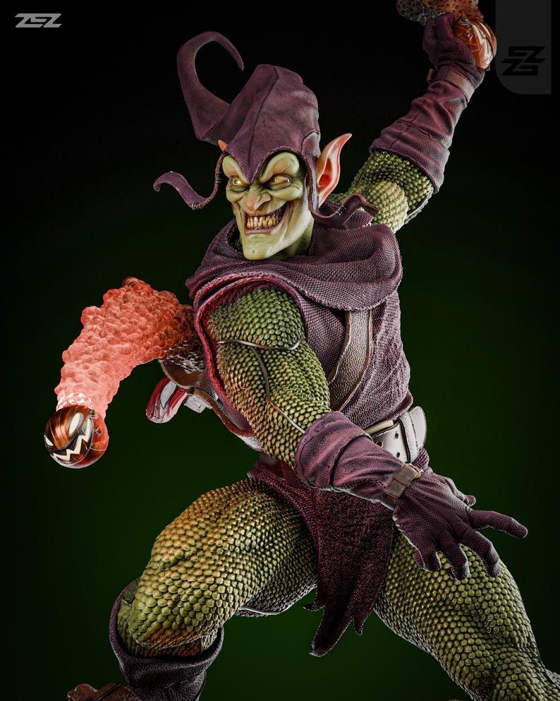 May include: Green Goblin action figure with a purple and green costume, a pointed hat, and a pumpkin bomb in his hand. The figure is posed in a dynamic action pose.