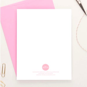May include: A blank white greeting card with a pink envelope. The back of the card has a pink circle with a logo and the text "LAANAMARTS GREETING CARDS & ILLUSTRATIONS INSTAGRAM @LAANAMARTS WEBSITE: WWW.LAANAMARTS.COM"