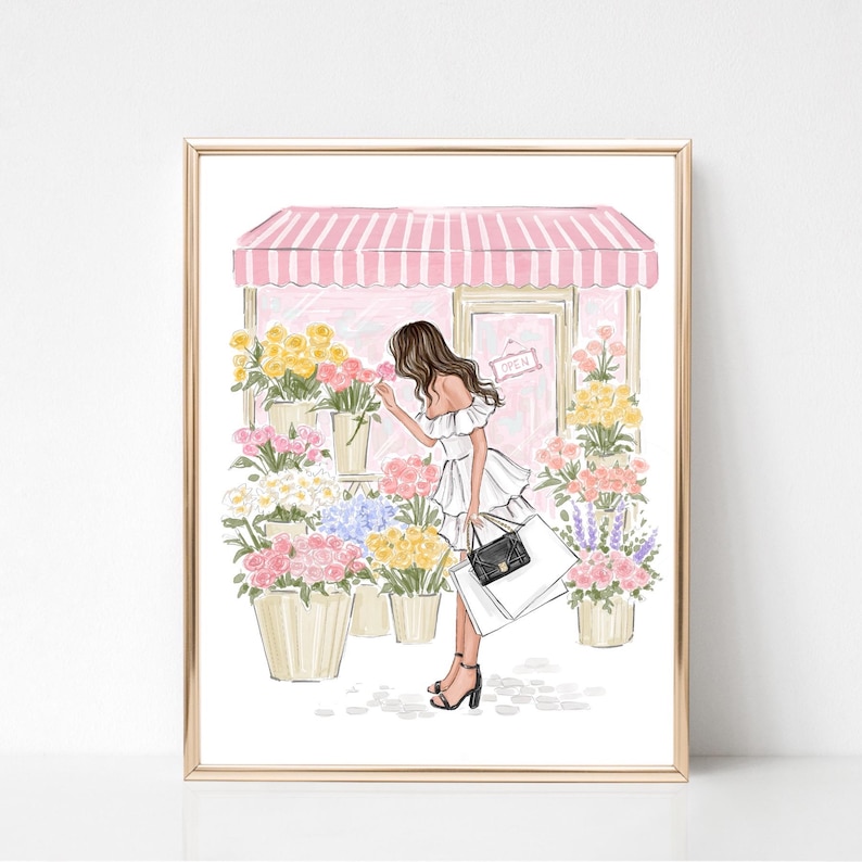 May include: A framed illustration of a woman smelling flowers outside a flower shop. The shop has a pink and white striped awning and a sign that says "OPEN". The woman is wearing a white dress and carrying shopping bags.