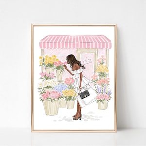 May include: Illustration of a woman in a white dress smelling flowers outside a flower shop. The shop has a pink and white striped awning and the word "OPEN" on the door. The image is framed in gold.