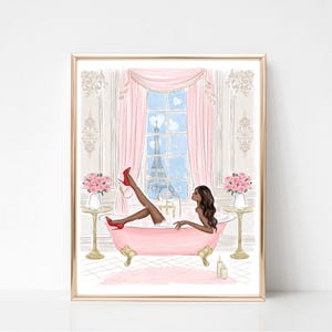 May include: A framed art print depicts a woman in a pink clawfoot bathtub, wearing red heels, with the Eiffel Tower visible through a window. The illustration features pink curtains, flowers, and a gold frame, creating a luxurious and feminine aesthetic.