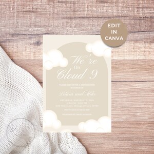 May include: A baby shower invitation with a beige background and white clouds. The text reads "We're On Cloud 9" and includes the names "Leticia and Mike", the date "Saturday, March 13th, 2024", the time "4:00 PM - 9:00 PM", the address "1234 Cloud Lane, Chicago, Illinois, 56789", and the RSVP information "RSVP to Maya at 555-4567". The invitation also states that the couple is registered at Target and Amazon.