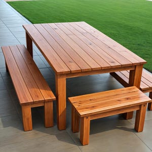 May include: A wooden outdoor dining set with a rectangular table and four benches. The table and benches are made of natural wood with a reddish-brown finish.