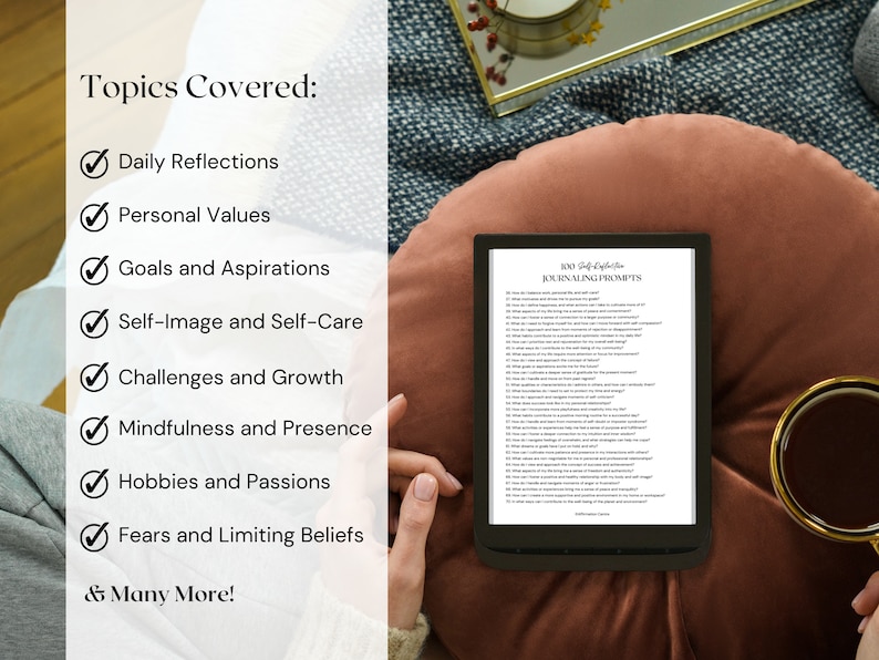 May include: An e-reader displaying "100 Self-Reflection Journaling Prompts" rests on a brown cushion. The topics covered include daily reflections, personal values, goals, self-image, challenges, mindfulness, hobbies, and fears. A gold-rimmed magnifying glass is nearby.