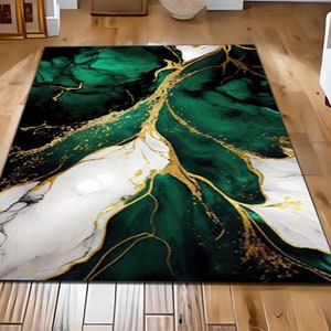 May include: Abstract area rug with a green and white marble design with gold accents. The rug has a modern and contemporary style.