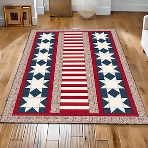 May include: A red, white, and blue patterned rug with a star design. The rug has a red and white striped center with a blue star pattern on each side.