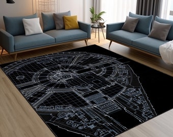 Może przedstawiać: Czarno-biały dywan z detalicznym konturem statku kosmicznego Millennium Falcon. Dywan leży na drewnianej podłodze w salonie.