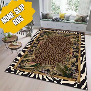 May include: Rectangular rug with a leopard print center, framed by a gold border and tropical foliage. The outer border features a black and white zebra stripe pattern. The text "NONE SLIP RUG" is in a yellow bubble in the upper left corner.
