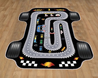 May include: A black and gray race track play rug with a gray road, black tires, and colorful race cars. The rug has a checkered finish line and flames on the bottom.