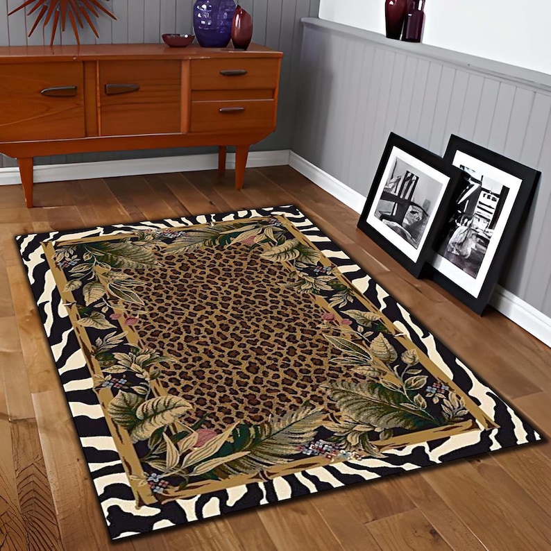 May include: A rectangular area rug with a leopard print center, framed by a botanical design and a zebra-striped border. The rug features shades of brown, green, and black, adding a touch of wild style to any room.