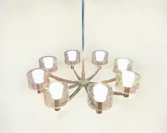 Space Age Sputnik chandelier from the 1970s in a modern design with 8 arms, attributed to Kaiser Idell, excellent condition.