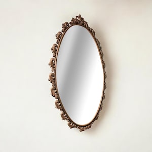 Large Art Nouveau mirror with a floral metal frame in very good condition.