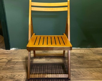 Original vintage French mid century folding chairs. Very solid made of multi-glued beech. A timeless classic from the 60s.