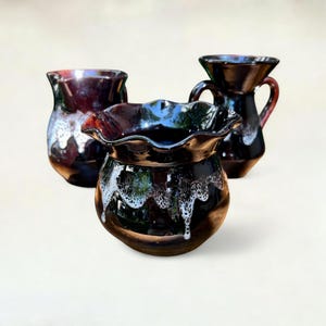 Vintage ceramic set consisting of a vase, pitcher, and amphora in a typical 1970s look