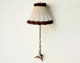 Solid mid-century brass floor lamp with claw feet. Very solid and elaborately crafted lampshade with velvet trim.