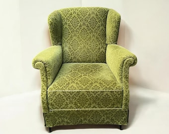 Danish vintage recliner chair / wingback chair in the style of Ilmari Lappalainen, made of green velvet, circa 1950s.