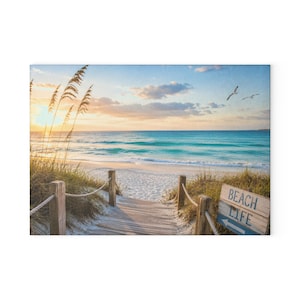 May include: A wooden boardwalk leads to a sandy beach at sunrise with turquoise ocean waves, tall sea oats, and two birds in flight. A weathered wooden sign on the right features the text BEACH LIFE with a blue arrow pointing toward the water.