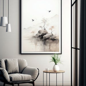 May include: A black framed print of a watercolor painting depicting a small island with trees and rocks in a misty landscape. Two birds fly overhead.